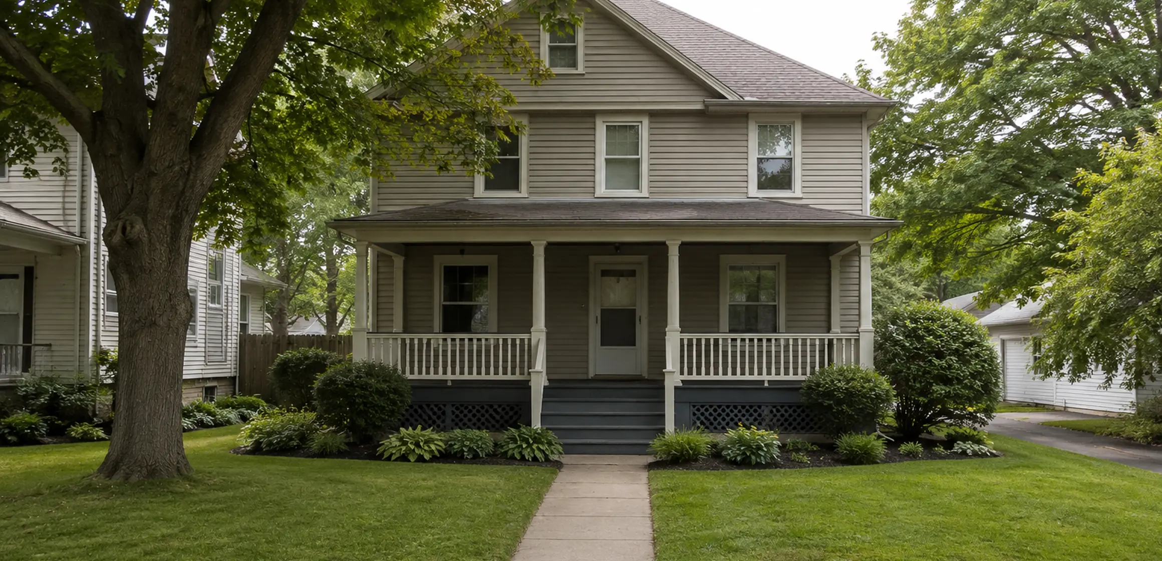 A Washtenaw County home with a for-sale sign in the front yard