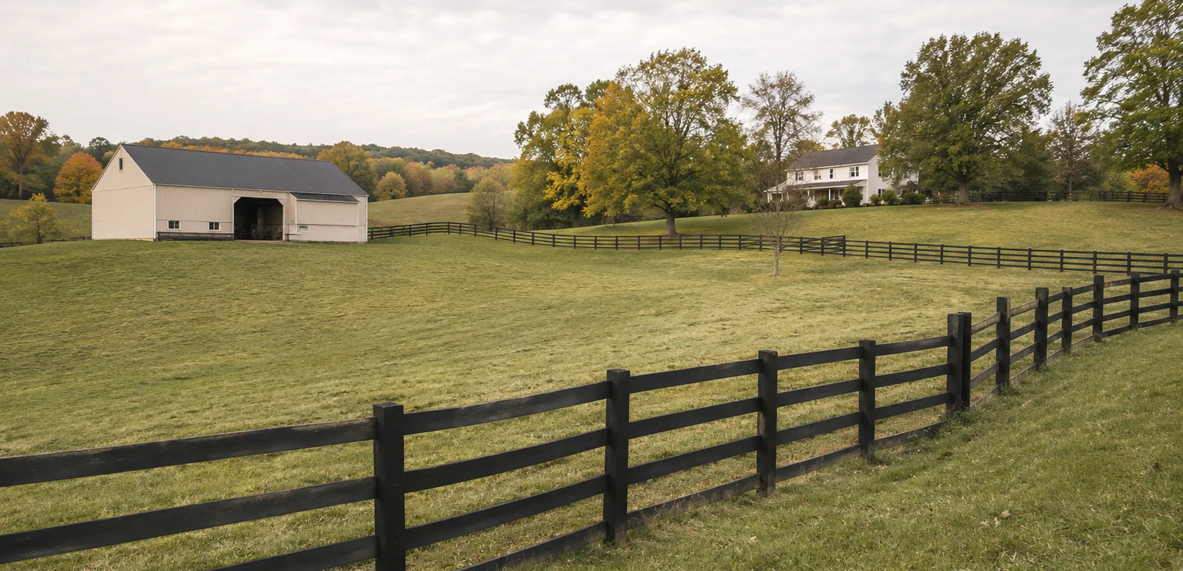 A fenced pasture and barn on an acreage property near Ann Arbor, Michigan